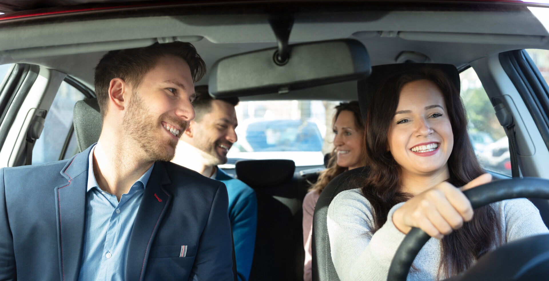 Smiling People Sitting In Car